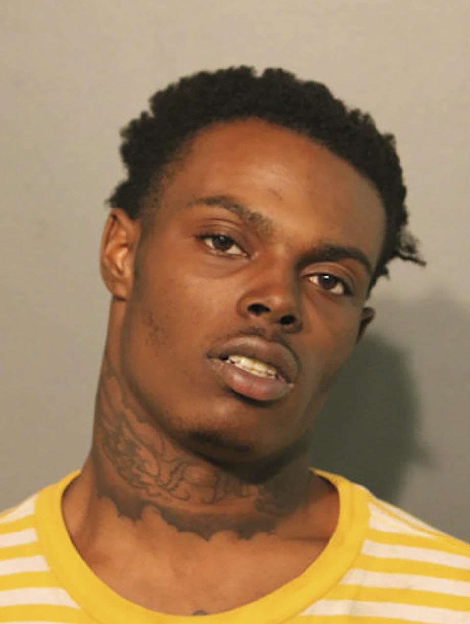 This photo provided by the Chicago Police Department shows Jaylun Sanders. Sanders is one of two men charged in a shooting that left two people dead and seven injured outside a fast food restaurant just blocks from Chicago’s famed Magnificent Mile shopping district. (Chicago Police Department via AP)