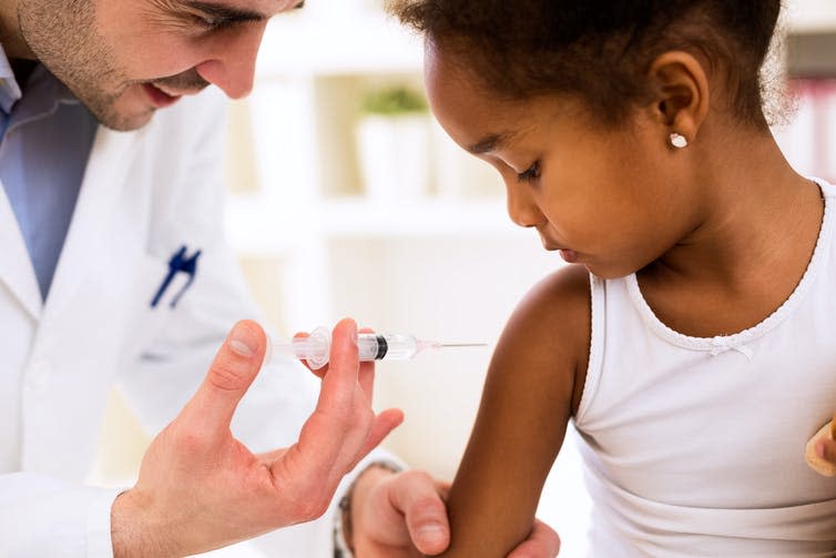 <span class="caption">We’ll need millions of doses of COVID-19 vaccine without affecting other vital vaccines.</span> <span class="attribution"><a class="link " href="https://www.shutterstock.com/image-photo/doctor-pediatrician-injecting-vaccine-cute-african-379214566" rel="nofollow noopener" target="_blank" data-ylk="slk:didesign021/Shutterstock;elm:context_link;itc:0;sec:content-canvas">didesign021/Shutterstock</a></span>