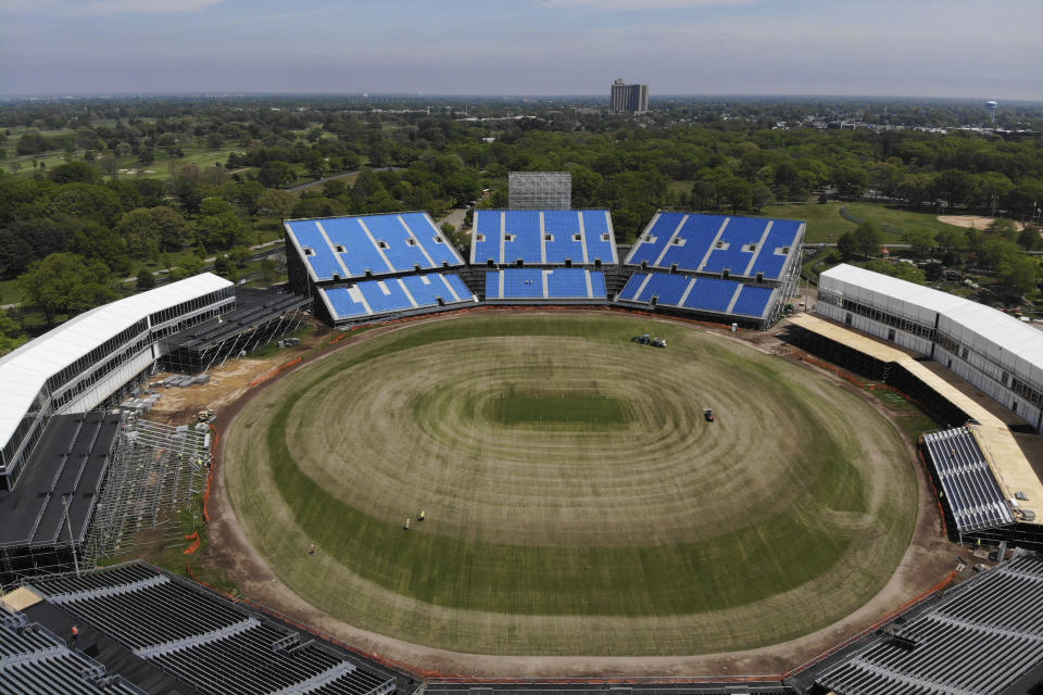 Work continues on a temporary stadium being constructed for the Cricket World Cup in East Meadow, N.Y., Wednesday, May 8, 2024. As the U.S. prepares to host its first Cricket World Cup across three states next month, a temporary stadium is rising in the NYC suburbs where the English sport has found fertile ground among waves of Caribbean and South Asian immigration. (AP Photo/Seth Wenig)