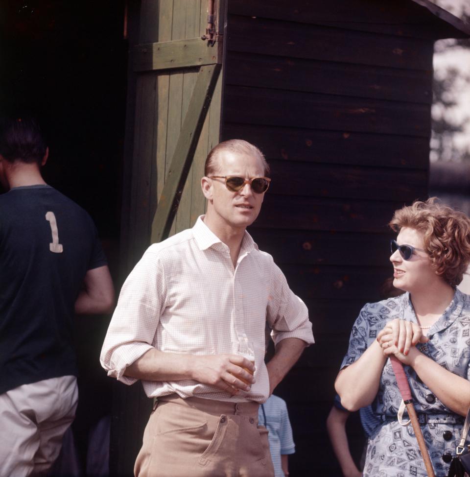 Prince Philip taking a beer during the chukas whilst umpiring a polo match at Ham Common, Richmond, 1961.Reginald Davis/Shutterstock