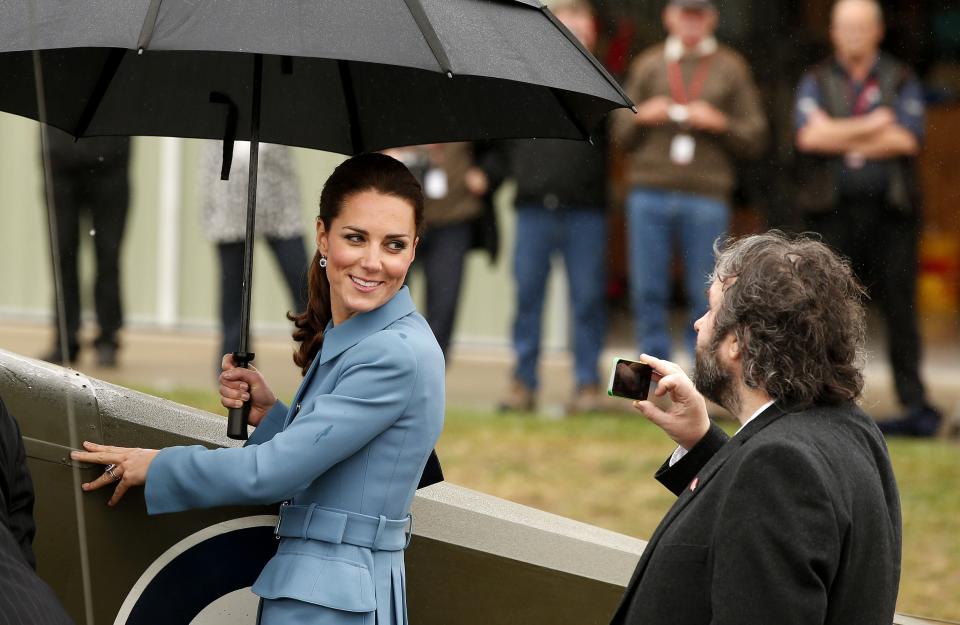 Britain's Catherine, the Duchess of Cambridge, is photographed by New Zealand film director Peter Jackson as she stands next to a Sopwith Pup vintage plane near Blenheim