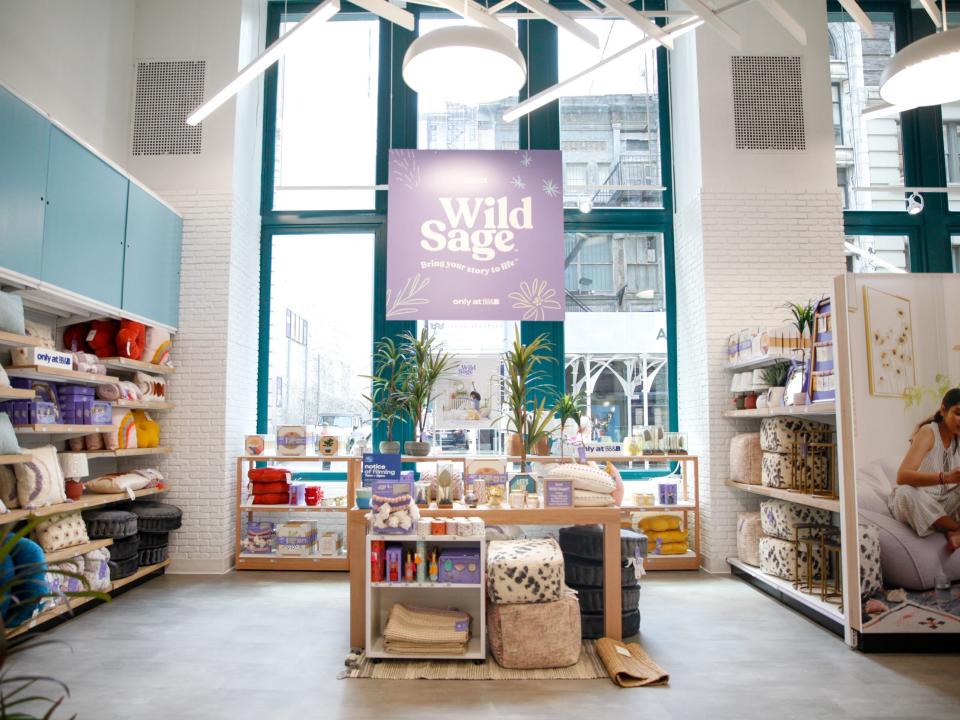 A display of Wild Sage products with tall windows