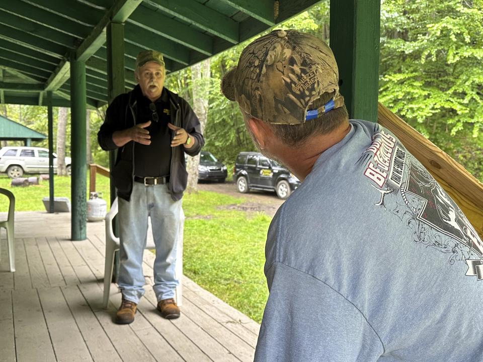 Treasure hunter Dennis Parada, left, and elk guide Eric McCarthy are shown at a hunting camp in Penfield, Pa., Aug. 23, 2023. McCarthy says he and a client heard loud clanking noises and saw a loaded armored truck during a 2018 FBI operation to recover a legendary cache of Civil War-era gold, which the FBI insists came up empty. (AP Photo/Michael Rubinkam)