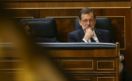 Spain's acting Prime Minister Mariano Rajoy listens to a speech during the investiture debate at the Parliament in Madrid, Spain, October 27, 2016. REUTERS/Andrea Comas
