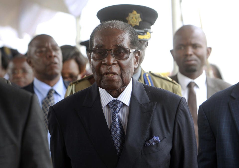 Robert Mugabe attends his first public occasion since being placed under house arrest