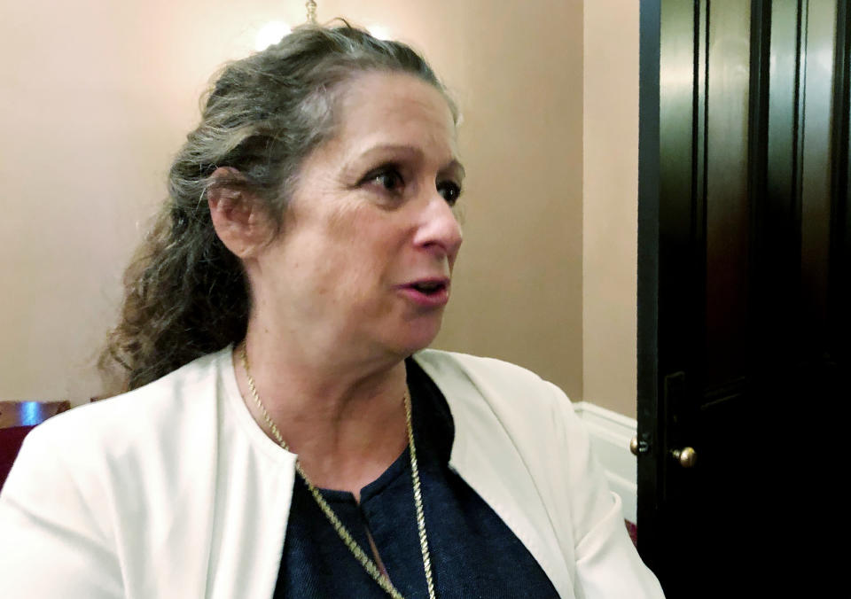 Abigail Disney, granddaughter of Walt Disney Co. co-founder Roy Disney, speaks with reporters at the Capitol in Sacramento, Calif., Wednesday, Jan. 15, 2020. Disney testified before state lawmakers in support of a bill that would raise taxes on some of the country's largest corporations. The size of the tax increase would depend on the gap between what a company pays its CEO versus the average salary for employees. The larger the gap, the higher the tax increase. (AP Photo/Adam Beam)