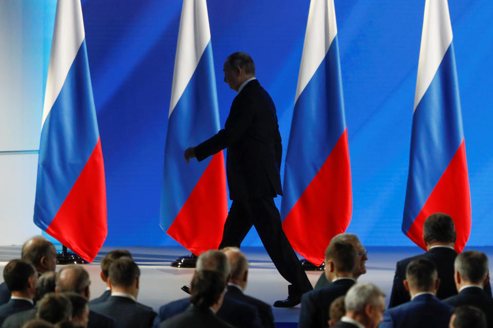 Russian President Putin leaves after delivering his address to the Federal Assembly in Moscow