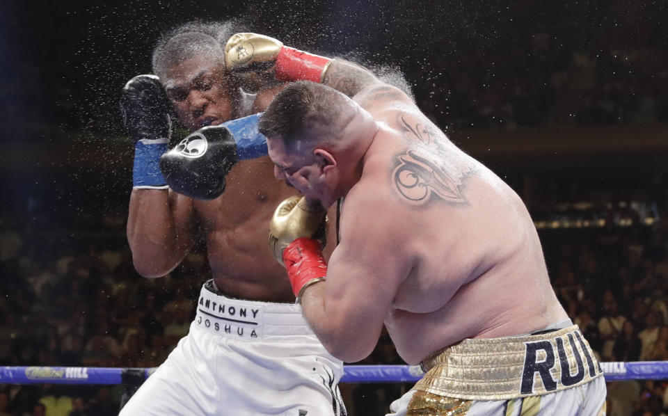 Andy Ruiz, right, and Anthony Joshua exchange punches during the seventh round of a heavyweight championship boxing match Saturday, June 1, 2019, in New York. Ruiz won in the seventh round. (AP Photo/Frank Franklin II)