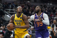 Indiana Pacers' Myles Turner (33) looks to shoot against Phoenix Suns' Jae Crowder (99) during the first half of an NBA basketball game, Friday, Jan. 14, 2022, in Indianapolis. (AP Photo/Darron Cummings)