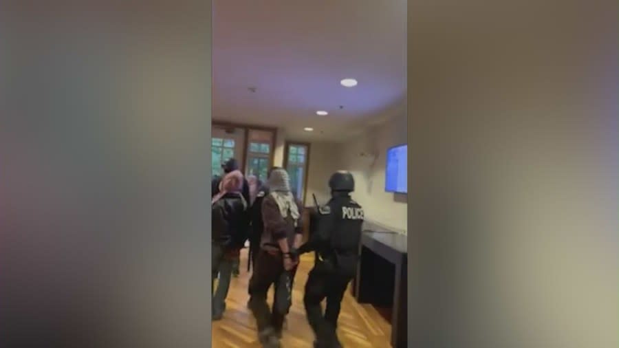 Video of the protest at Alexander Hall taken by Samson Zhang shows police officers detaining demonstrators and escorting them down a staircase. (Samson Zhang)