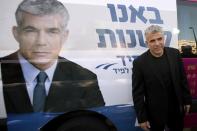 Israeli actor, journalist and author Yair Lapid, leader of the Yesh Atid party, visits a polling station in the coastal city of Netanya, on January 22, 2013