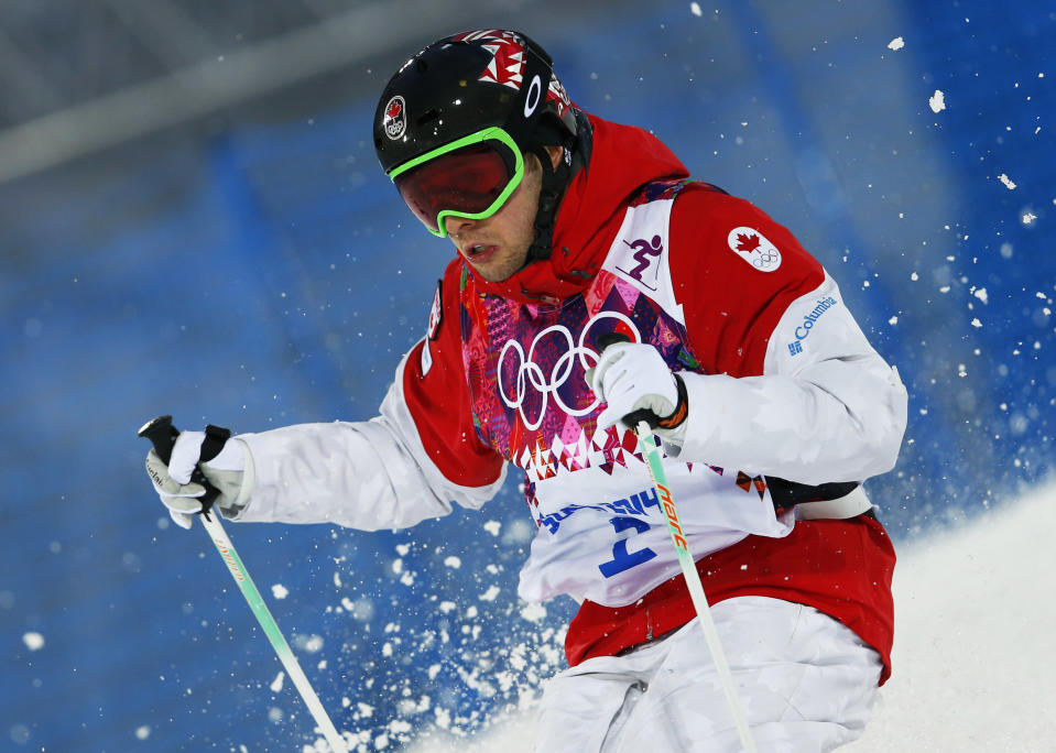 Canada's Alex Bilodeau runs the course during the men's moguls qualifying at the Rosa Khutor Extreme Park at the 2014 Winter Olympics, Monday, Feb. 10, 2014, in Krasnaya Polyana, Russia. (AP Photo/Sergei Grits)