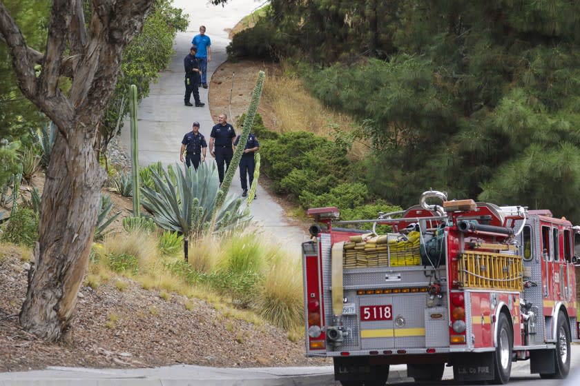 DUARTE, CA - SEPTEMBER 08: Los Angeles County fire structure protection crew deployed due to threat from Bobcat survey a residence at 3200 Brookridge Road on Tuesday, Sept. 8, 2020 in Duarte, CA. (Irfan Khan / Los Angeles Times)