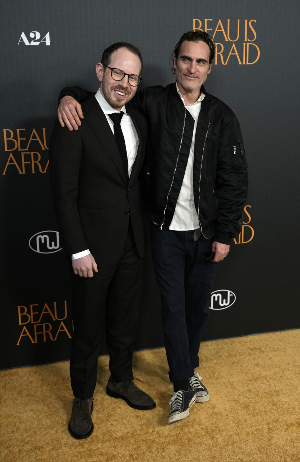 Ari Aster, left, writer/director of "Beau Is Afraid," poses with star Joaquin Phoenix at the premiere of the film, Monday, April 10, 2023, at the Directors Guild of America in Los Angeles. (AP Photo/Chris Pizzello)