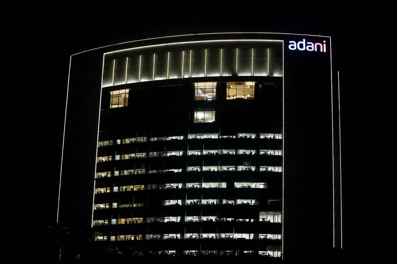 FILE PHOTO: The logo of the Adani Group is seen on the facade of its Corporate House on the outskirts of Ahmedabad