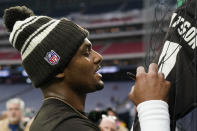 Cleveland Browns quarterback Deshaun Watson signs autographs before of an NFL football game between the Cleveland Browns and Houston Texans in Houston, Sunday, Dec. 4, 2022,. (AP Photo/Eric Gay)