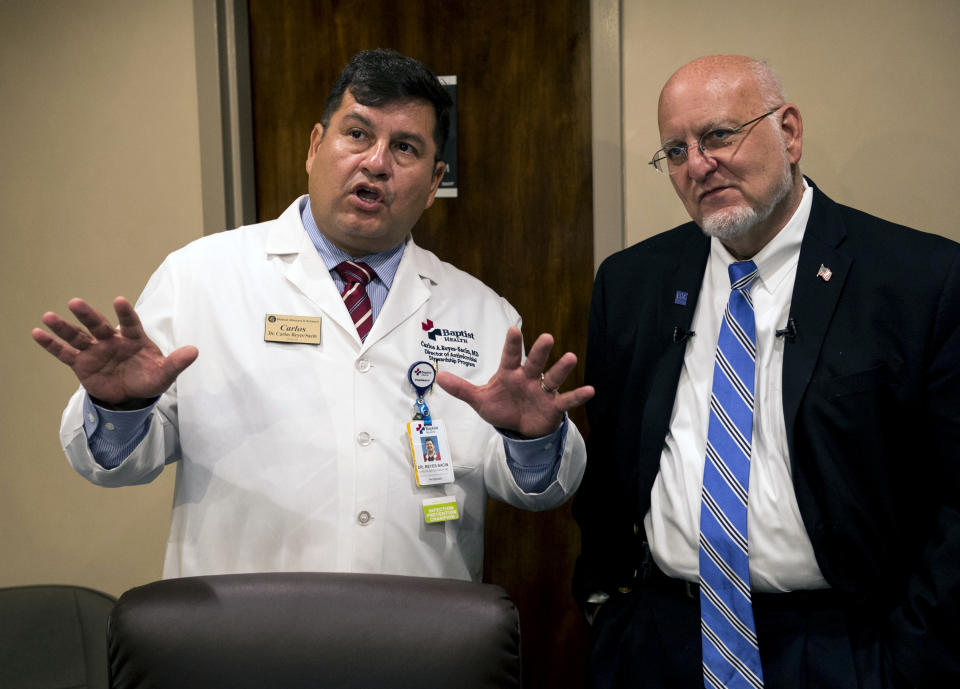 Dr. Carlos Reyes-Sacin, left, shows CDC director Robert Redfield inside a telemedicine room at the Medical Advocacy and Outreach clinic in Montgomery, Ala. on Friday, June 14, 2019. (Jake Crandall/Montgomery Advertiser via AP)