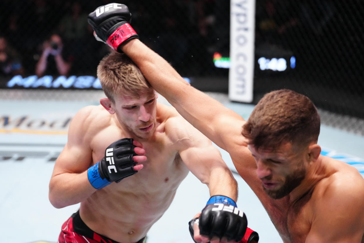 Arnold Allen (left) punches Calvin Kattar in a featherweight fight during UFC Fight Night at UFC Apex on October 29, 2022 in Las Vegas, Nevada. (Photo by Jeff Bottari/Zuffa LLC)