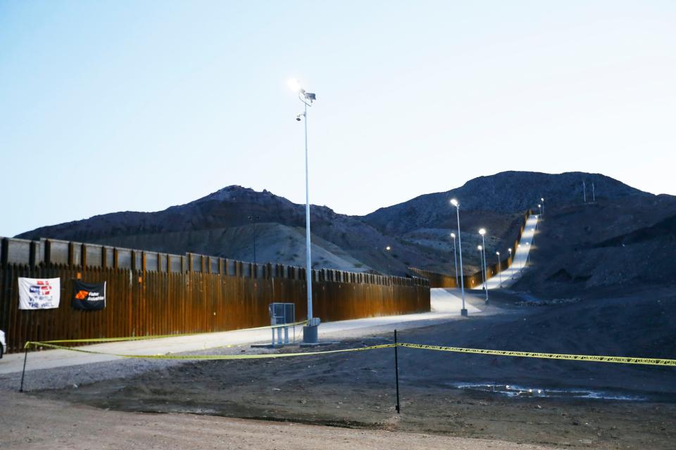 The We Build the Wall steel, border wall is illuminated by lights June 11, 2019, in Sunland Park, New Mexico.