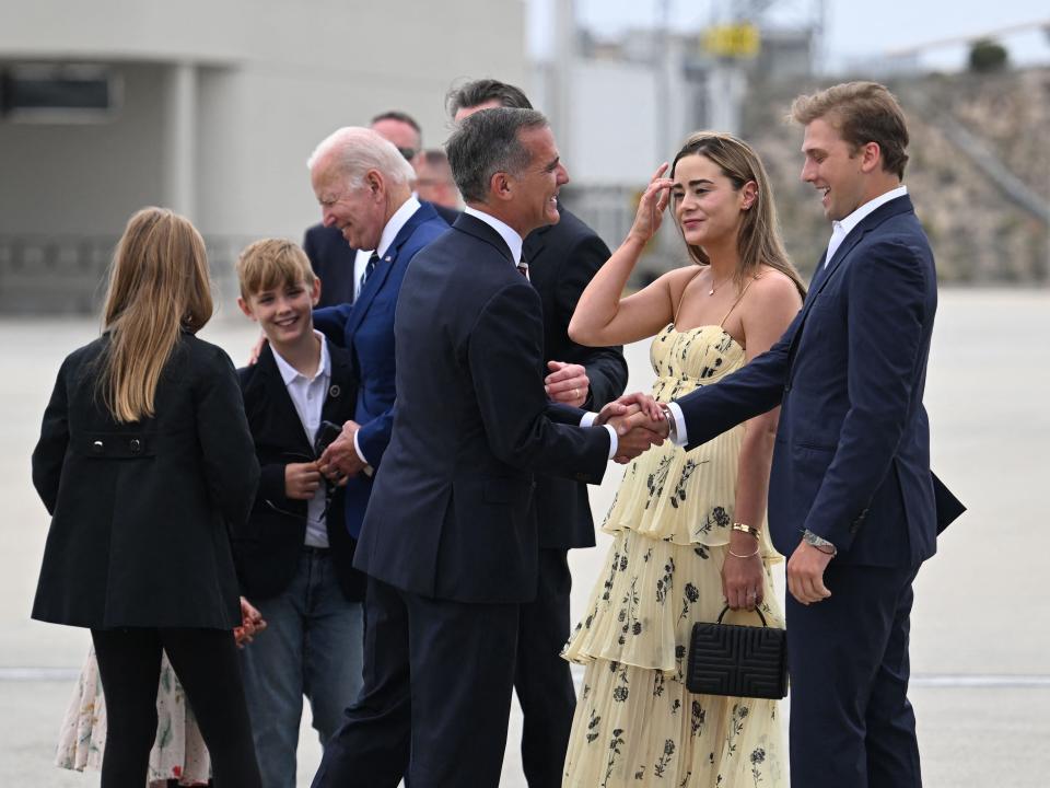 Naomi Biden and Peter Neal greet Governor Gavin Newsom.