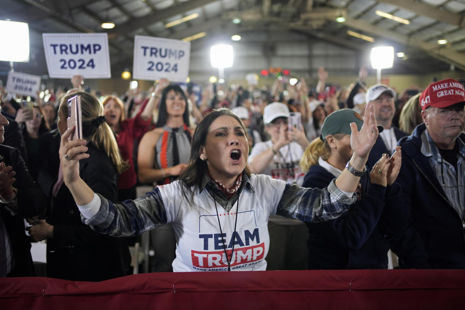 A woman cheers as Republican presidential candidate former President Donald Trump speaks at a campaign event Saturday, Jan. 27, 2024, in Las Vegas. (AP Photo/John Locher)