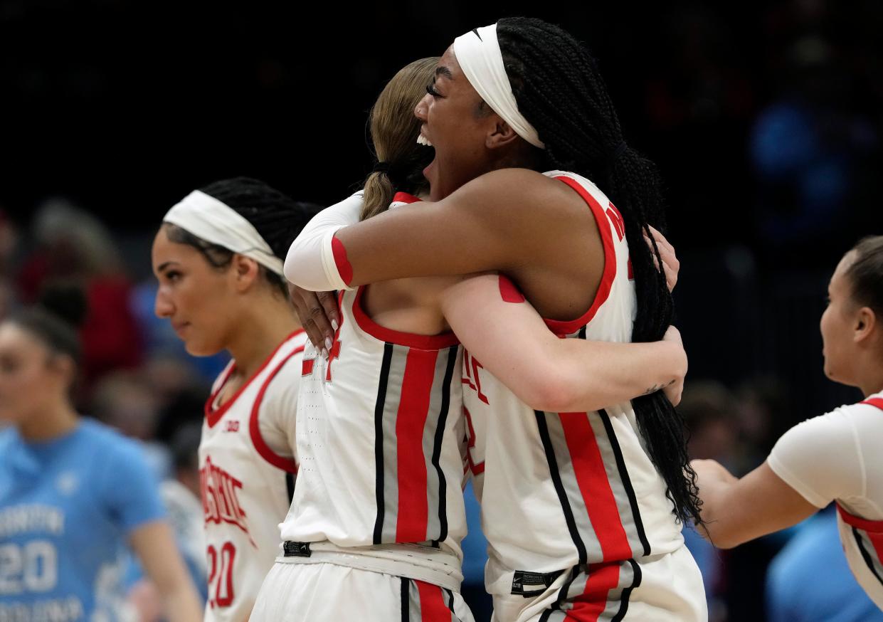 Ohio State forward Cotie McMahon, right, hugs guard Taylor Mikesell after beating North Carolina 71-69 in the second round of the NCAA Tournament.