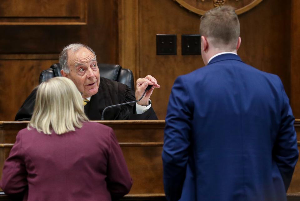 Brown County Circuit Judge Donald Zuidmulder holds a bench conference with defense attorney Britteny Koenig and Deputy District Attorney Caleb Saunders on Tuesday at the Brown County Courthouse in Green Bay.