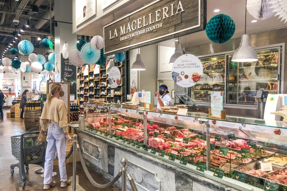 A shopper looks at the meat selection at Eataly in Century City.