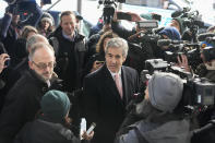 Donald Trump’s former lawyer and fixer Michael Cohen, center, is surrounded by reporters as he arrives for a second day of testimony before a grand jury investigating hush money payments he arranged and made on the former president’s behalf, Wednesday, March 15, 2023, in New York. (AP Photo/Mary Altaffer)