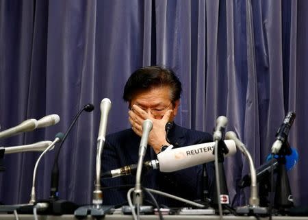 Mitsubishi Motors Corp.'s President Tetsuro Aikawa attends a news conference at the Land, Infrastructure, Transport and Tourism Ministry in Tokyo, Japan, May 18, 2016. REUTERS/Thomas Peter