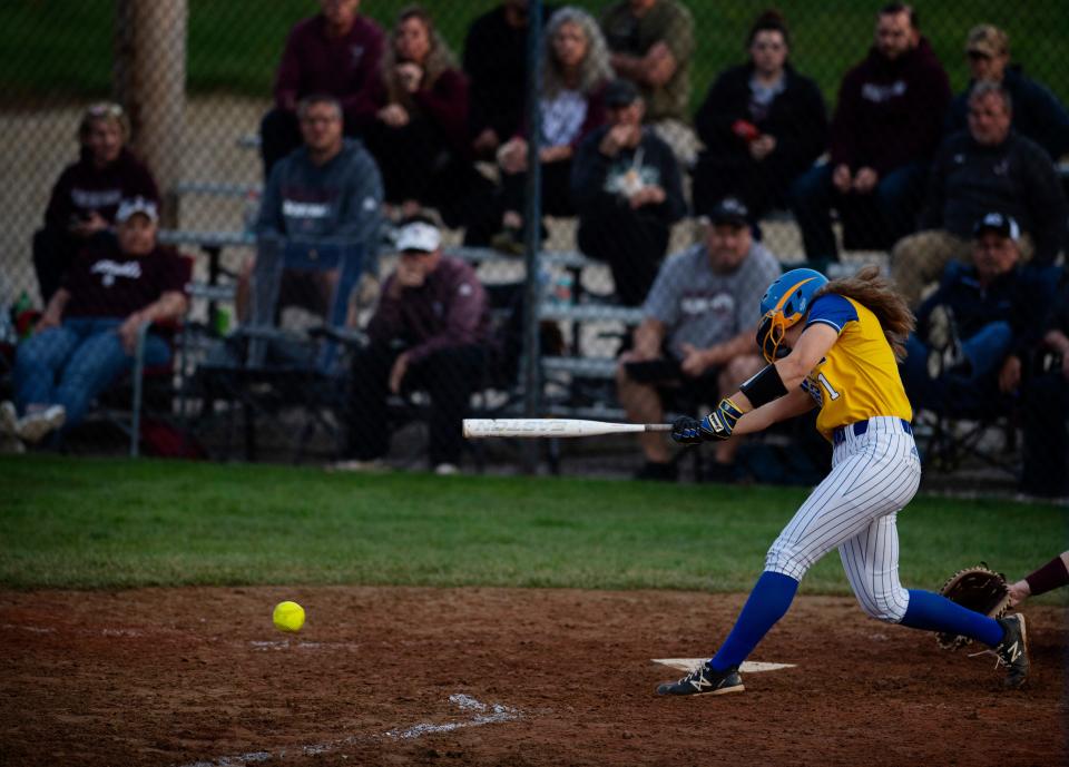 Castle's Jackie Lis gets a hit against Henderson County at Castle High School Tuesday evening, April 12, 2022.
