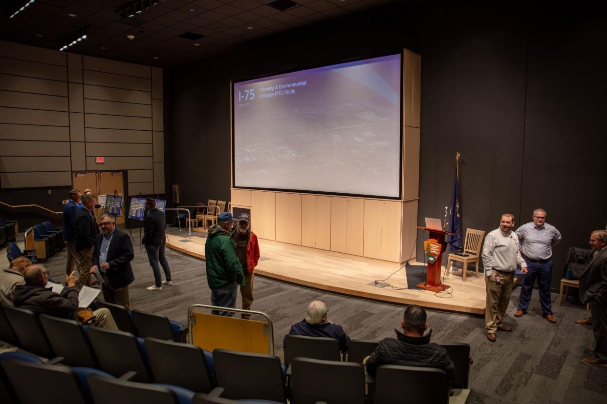 Local residents gather to discuss possible plans to revamp the Front Avenue and Elm Street interchanges with I-75 in Monroe during an open house hosted by the Michigan Department of Transportation March 15 at the River Raisin Battlefield Visitor Center theater.