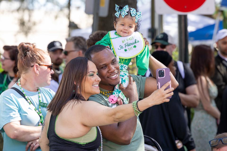Amada and Bryan Jordan of Savannah capture a selfie with their daughter, Carmen, to celebrate their baby's first St. Patrick's Day Parade.