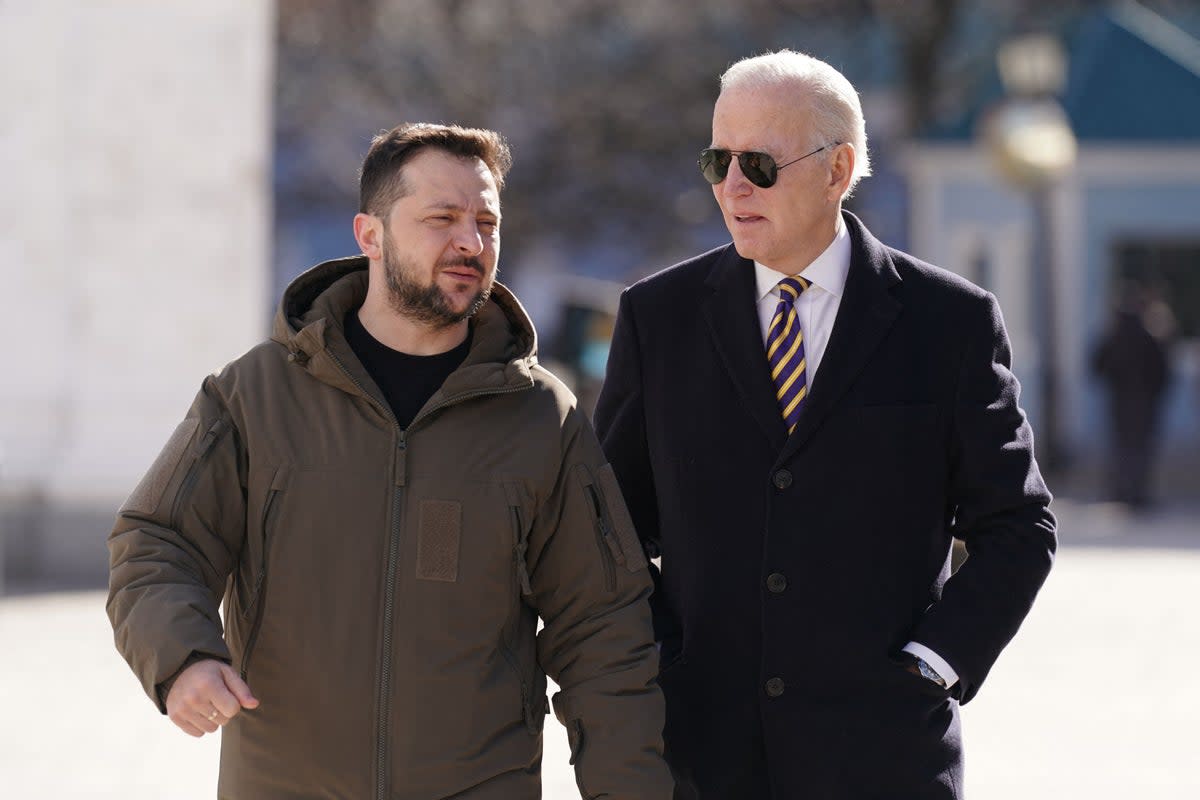 Joe Biden walks next to Ukrainian President Volodymyr Zelensky as he arrives for a visit in Kyiv (AFP via Getty Images)
