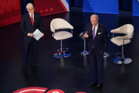 President Joe Biden participates in a CNN town hall at the Baltimore Center Stage Pearlstone Theater, Thursday, Oct. 21, 2021, in Baltimore, with moderator Anderson Cooper. (AP Photo/Evan Vucci)