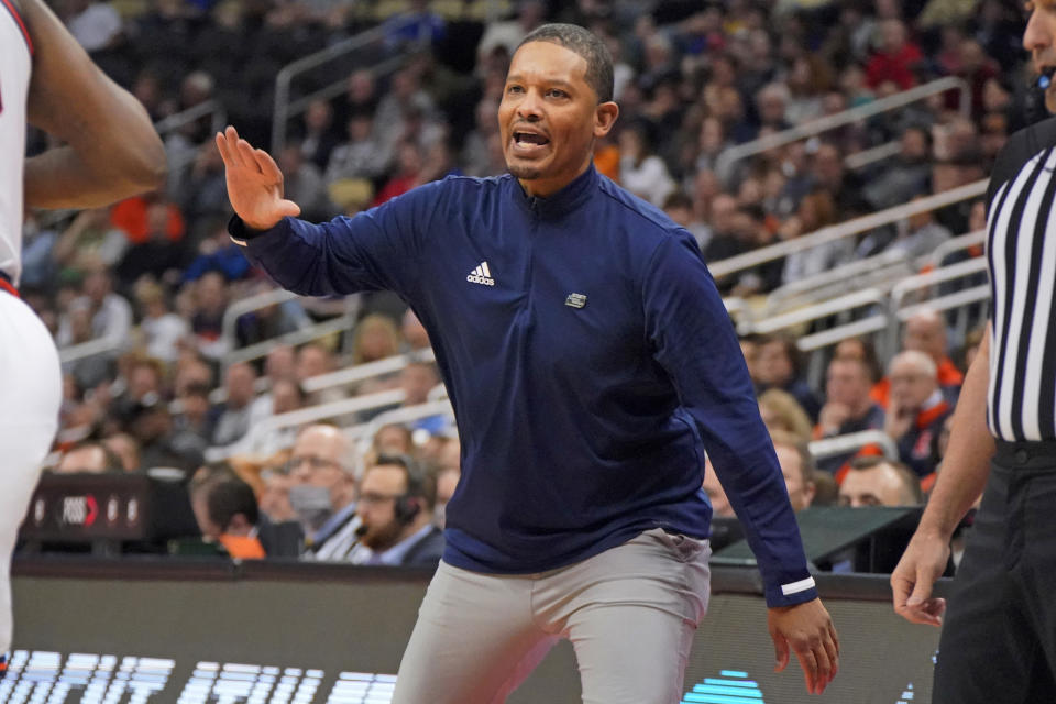 FILE - Chattanooga head coach Lamont Paris yells instructions during the first half of a college basketball game against Illinois in the first round of the NCAA men's tournament in Pittsburgh on March 18, 2022. (AP Photo/Gene J. Puskar, File)