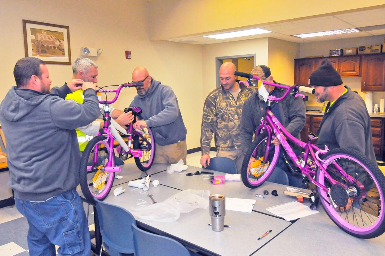 A group of Wayne County Engineer's Office employees spent an afternoon assembling bicycles. The bikes will be given to children countywide through the Fraternal Order of the Police’s Shop with a Hero program and OneEighty.