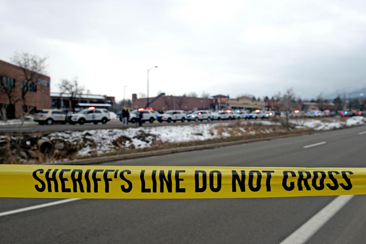 Crime scene tape closes off access to the King Soopers grocery store in Boulder, Colorado on March 22, 2021.