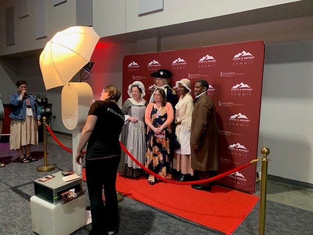 Historical reenactors pose for a portrait at the South Dakota Department of Education's Civics and History Summit in Sioux Falls on June 12, 2023.