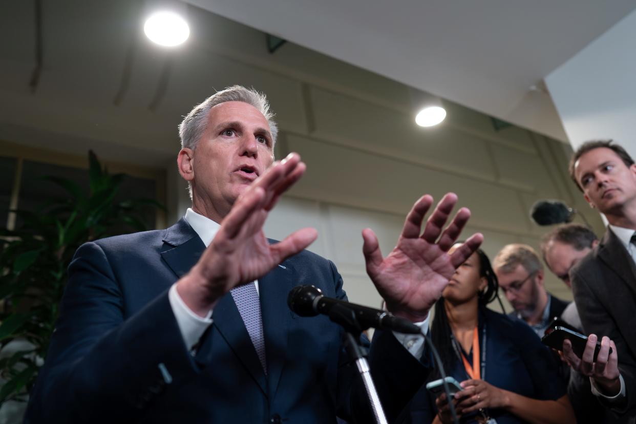 Speaker of the House Kevin McCarthy talks to reporters Friday. Congress approved a temporary funding bill late Saturday night, avoiding a government shutdown.
