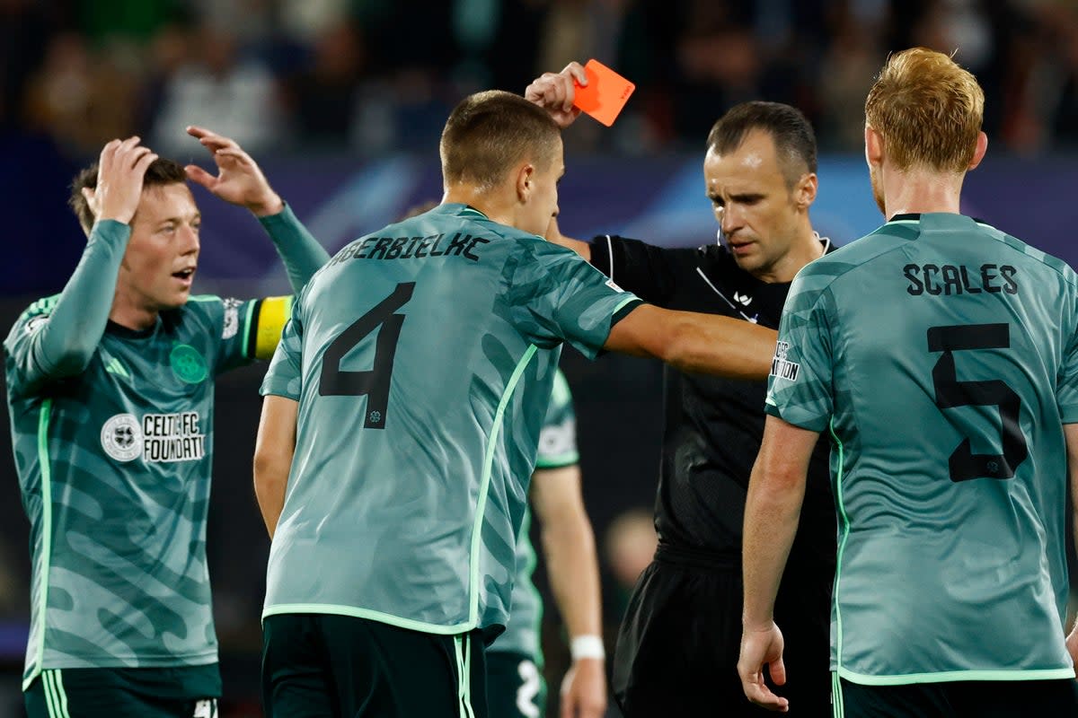 Marching orders: Gustaf Lagerbielke was one of two Celtic players sent off in their defeat at Feyenoord  (REUTERS)