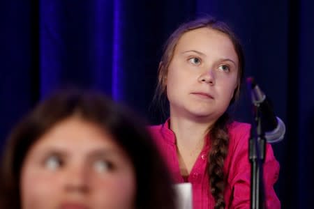 Swedish climate activist Greta Thunberg listens after presenting a landmark complaint to the United Nations Committee on the Rights of the Child to protest the lack of government action on the climate crisis during a press conference in New York