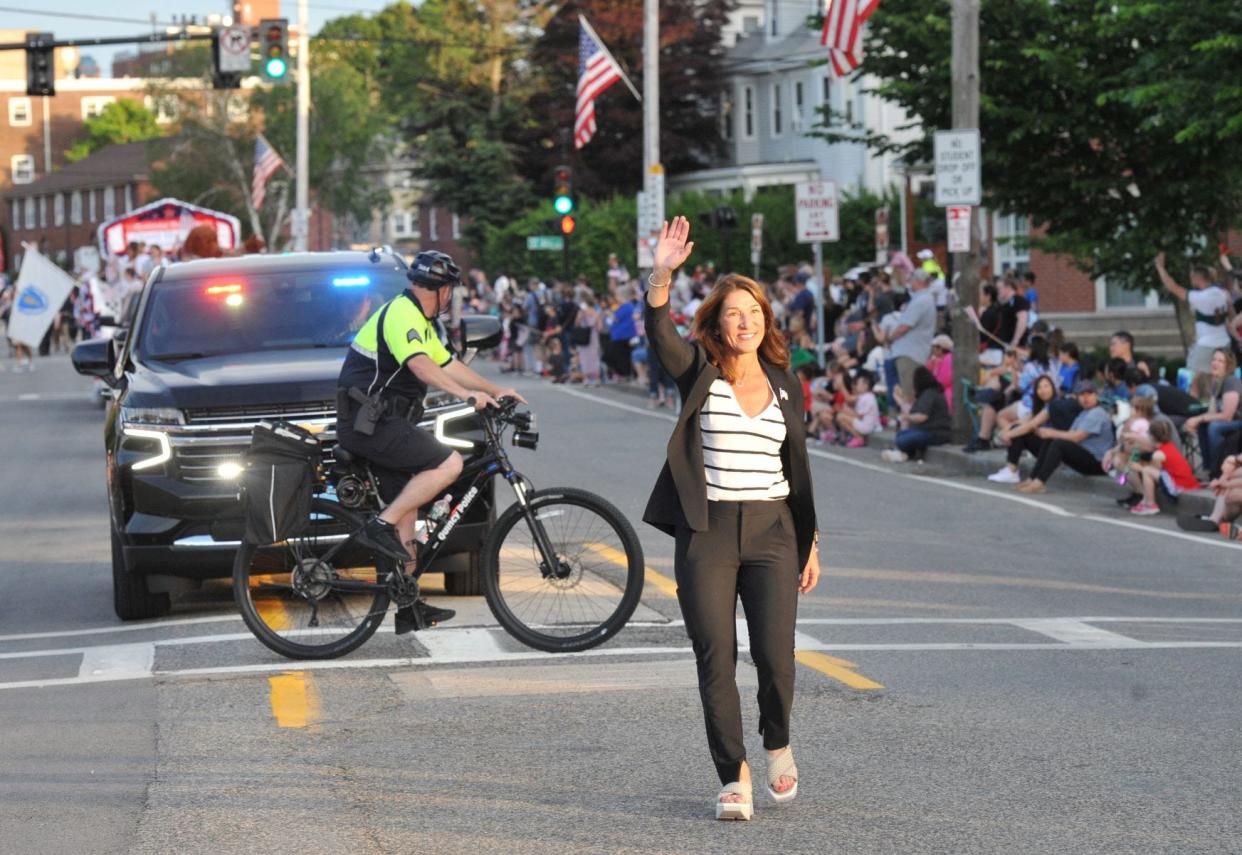 Lt. Gov. Karyn Polito waves as she marches during the Quincy Flag Day Parade June 11, 2022.