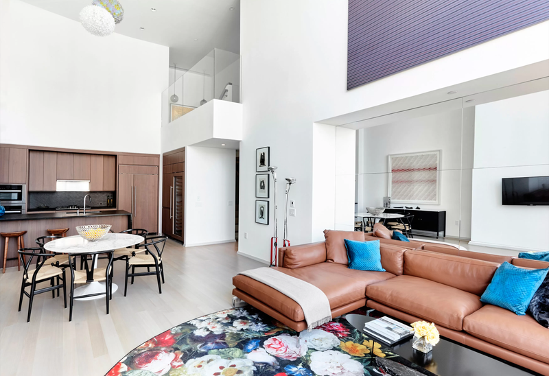 Another view inside the living and kitchen in the Williams’ condo at 50 West. - Screenshot: MLS