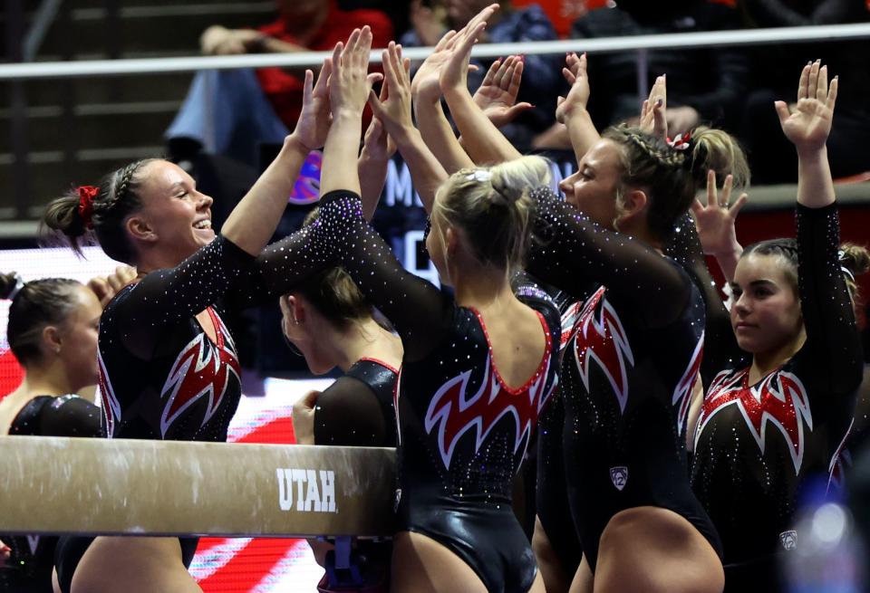 Utah’s Maile O’Keefe high-fives her teammates after finishing a perfect 10 beam routine during a gymnastics meet against Boise State at the Huntsman Center in Salt Lake City on Friday, Jan. 5, 2024. The Utah Red Rocks won. | Kristin Murphy, Deseret News