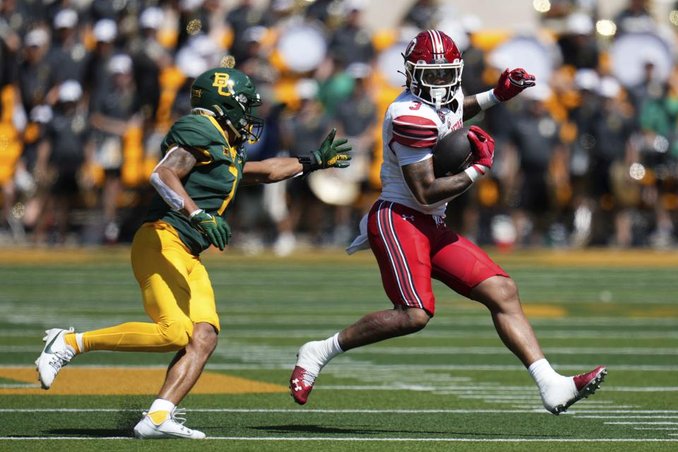 Utah running back Ja’Quinden Jackson breaks free for a 44-yard run as Baylor Bears safety Bryson Jackson chases in the first half of an NCAA college football game, Saturday, Sept. 9, 2023, in Waco, Texas.(Chris Jones/Waco Tribune-Herald via AP) | AP