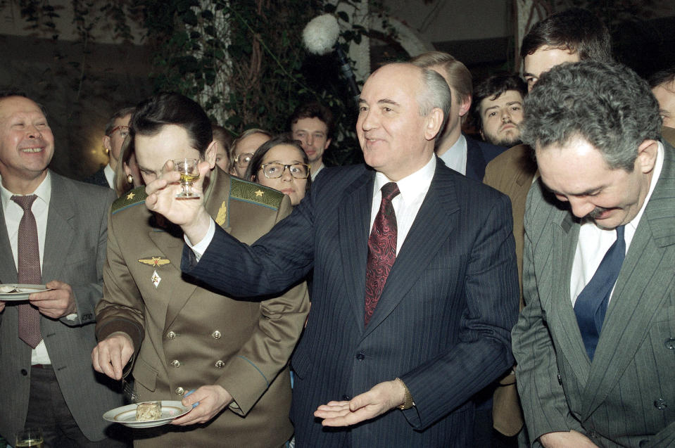FILE - Former Soviet President Mikhail Gorbachev holds a glass of vodka at his farewell party in Oktyabrskaya Hotel in Moscow on Dec. 26, 1991. While Gorbachev was taking desperate efforts to negotiate a new "union treaty" between Soviet republics to preserve the USSR in the fall of 1991, he faced stiff resistance from his arch-rival, Russian Federation's head Boris Yeltsin, and other independent-minded leaders of Soviet republics. (AP Photo/Alexander Zemlianichenko, File)