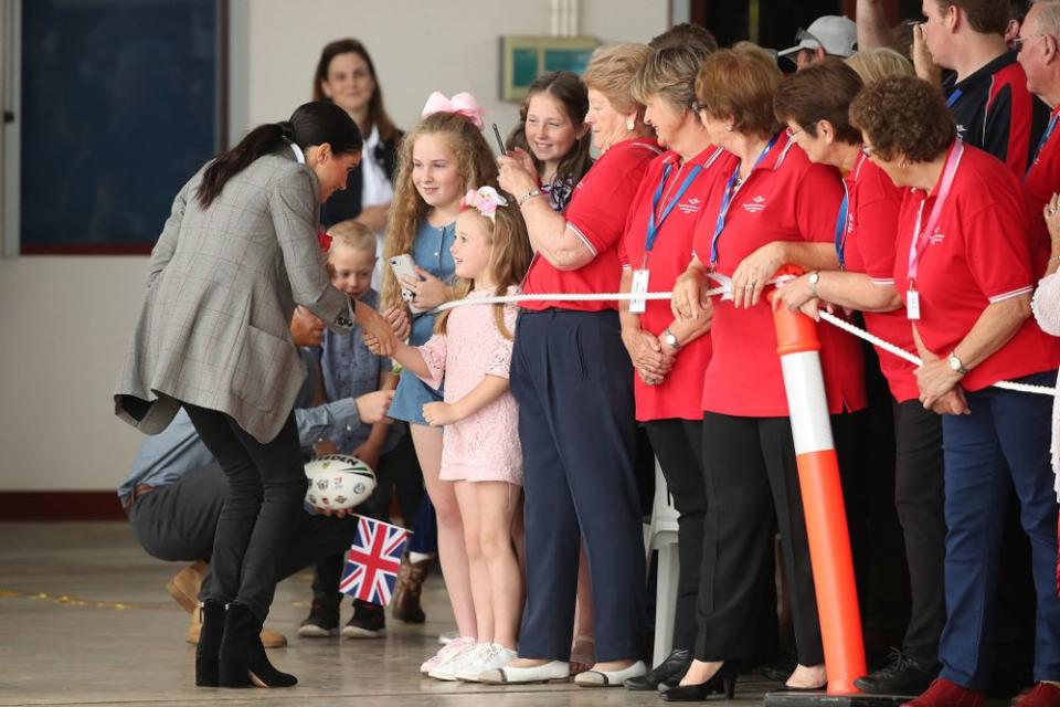 Meghan Markle greeting young fans