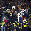 FILE - In this Nov. 4, 2018, file photo, Los Angeles Rams cornerback Marcus Peters (22) breaks up a pass intended for New Orleans Saints wide receiver Michael Thomas (13) in the first half of an NFL football game, in New Orleans. Marcus Peters is ready to eat. The Rams' volatile cornerback promised to have "a nice little bowl of gumbo" with New Orleans coach Sean Payton after Peters felt disrespected in the wake of the Saints' win over Los Angeles earlier this season. (AP Photo/Butch Dill, File)