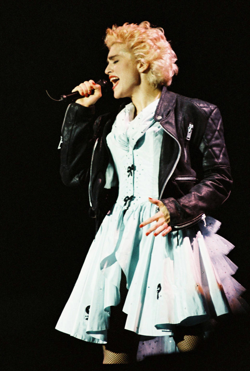 Madonna performing on stage during her Who's That Girl tour at Wembley Stadium in 1987